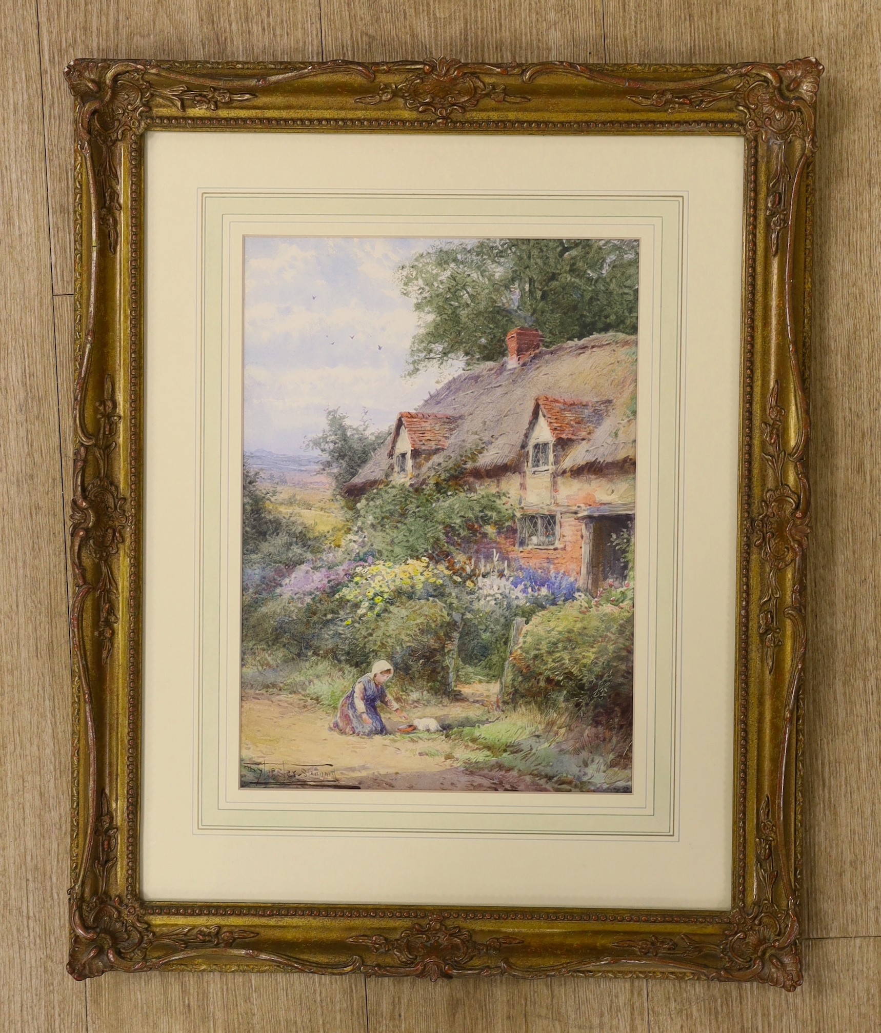 Henry John Sylvester Stannard (1870-1951), watercolour, Child and kitten beside a thatched cottage, signed, 35 x 25cm